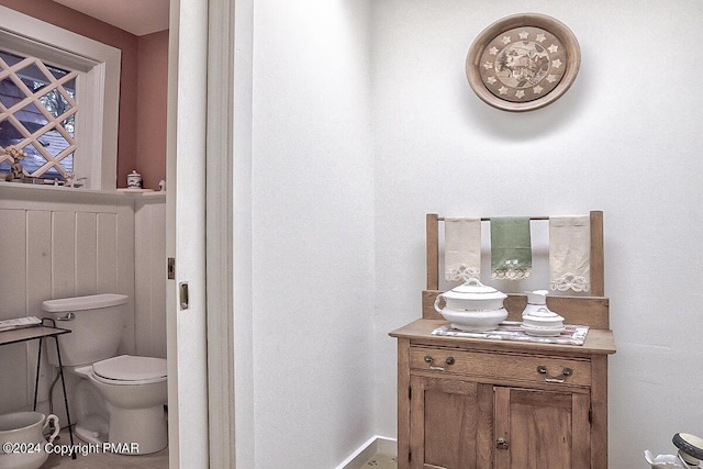 bathroom featuring toilet and vanity