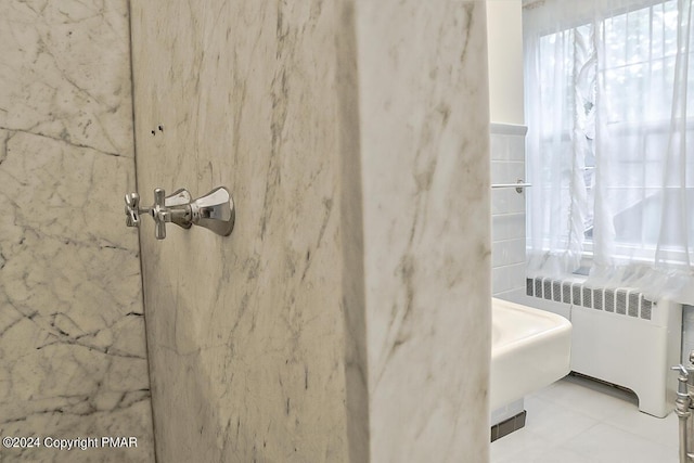 bathroom featuring radiator