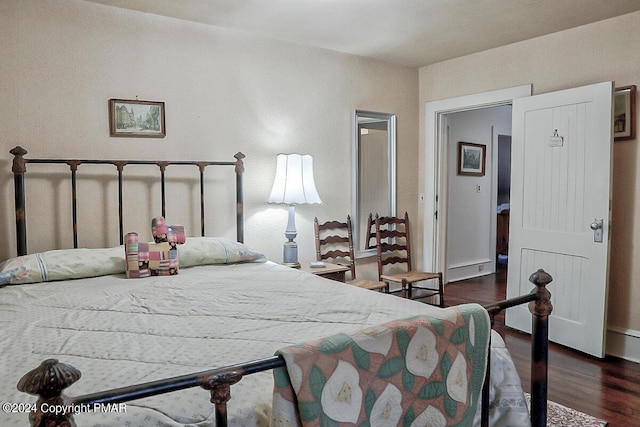 bedroom featuring wood finished floors