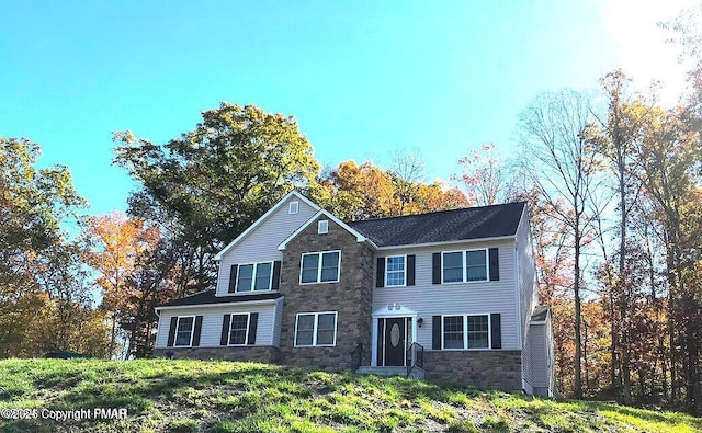 view of front of property featuring stone siding