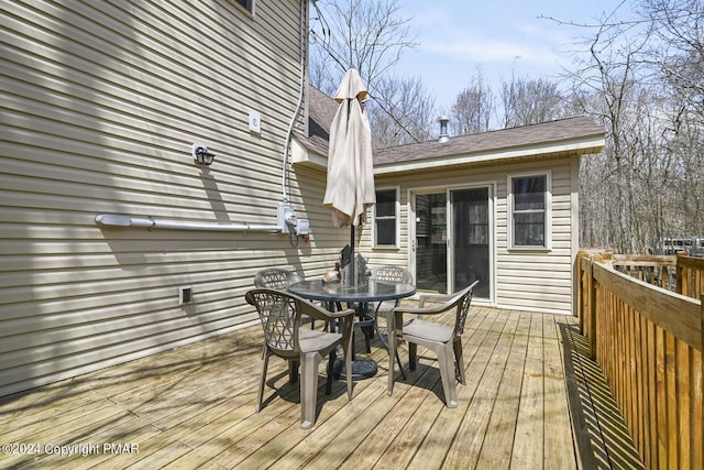 deck featuring outdoor dining area