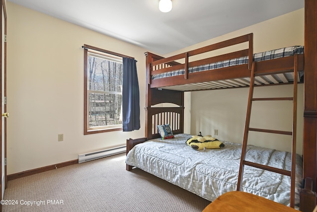 bedroom with a baseboard radiator, baseboards, and carpet