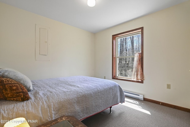 carpeted bedroom featuring a baseboard heating unit, electric panel, and baseboards