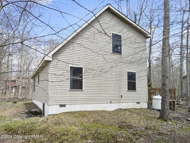 view of property exterior featuring crawl space