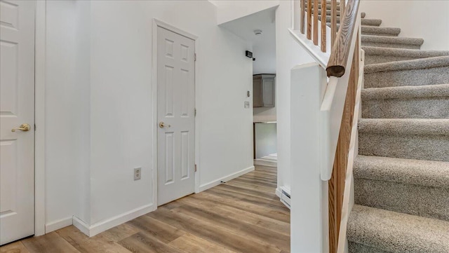 79 Delaware Dr, Jim Thorpe, PA 18229 - stairway featuring wood finished floors, baseboard heating, and baseboards