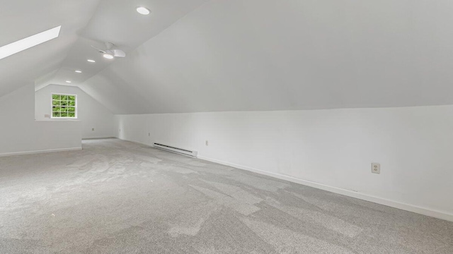 79 Delaware Dr, Jim Thorpe, PA 18229 - additional living space with a baseboard heating unit, lofted ceiling, carpet floors, a skylight, and baseboards