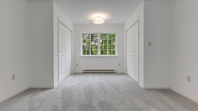 79 Delaware Dr, Jim Thorpe, PA 18229 - unfurnished bedroom with two closets, a baseboard radiator, and carpet floors