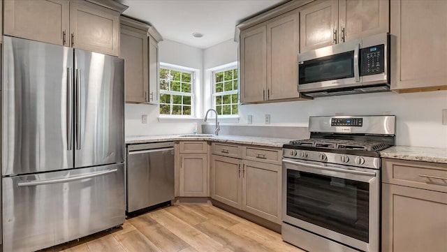 79 Delaware Dr, Jim Thorpe, PA 18229 - kitchen with stainless steel appliances, a sink, light wood finished floors, light stone counters, and recessed lighting