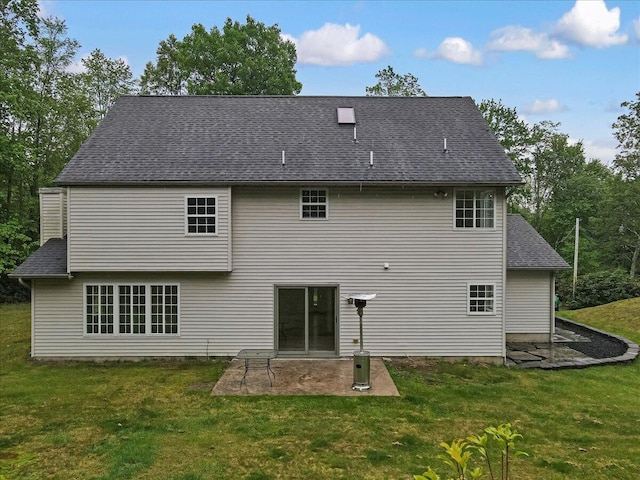 79 Delaware Dr, Jim Thorpe, PA 18229 - back of property with a patio area, a lawn, and roof with shingles