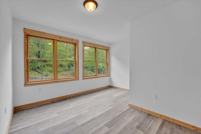 1448 Lake Ln, Pocono Lake, PA 18347 - unfurnished room with healthy amount of natural light, light wood-style flooring, and baseboards