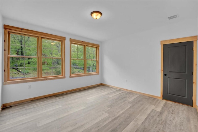 1448 Lake Ln, Pocono Lake, PA 18347 - unfurnished room with light wood-style floors, healthy amount of natural light, and baseboards