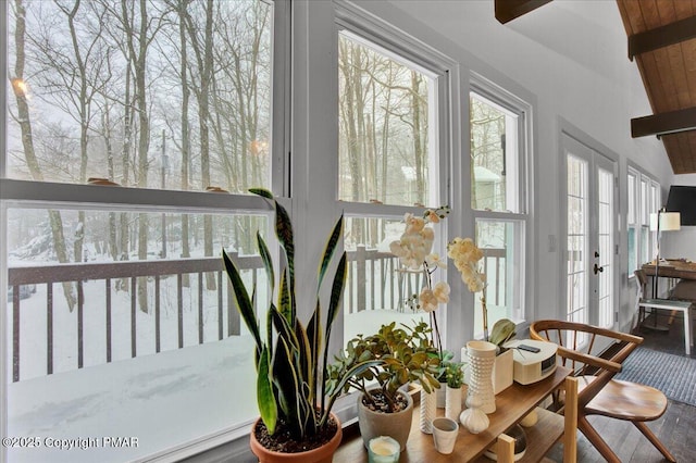 sunroom with beamed ceiling