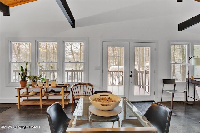 dining space featuring dark wood-type flooring, french doors, vaulted ceiling with beams, and baseboards