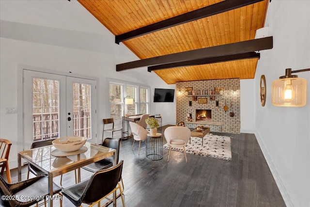 dining area featuring a fireplace, wood ceiling, baseboards, french doors, and beamed ceiling