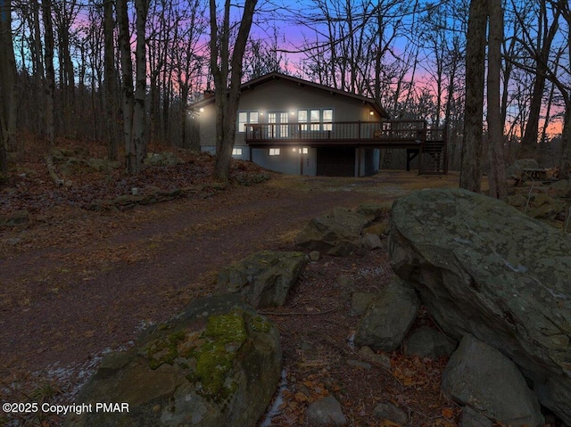 view of front of property featuring a wooden deck