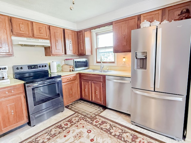 353 Bollinger Rd, Kunkletown, PA 18058 - kitchen with stainless steel appliances, under cabinet range hood, a sink, light countertops, and ornamental molding