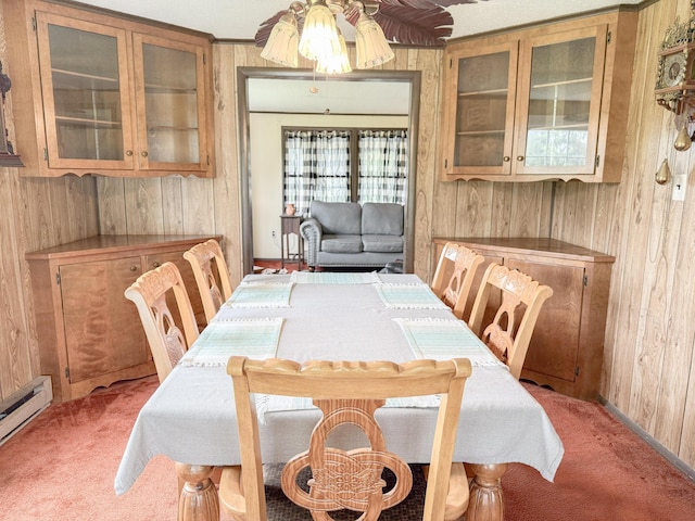 353 Bollinger Rd, Kunkletown, PA 18058 - dining area with wood walls, light colored carpet, baseboard heating, ceiling fan, and baseboards