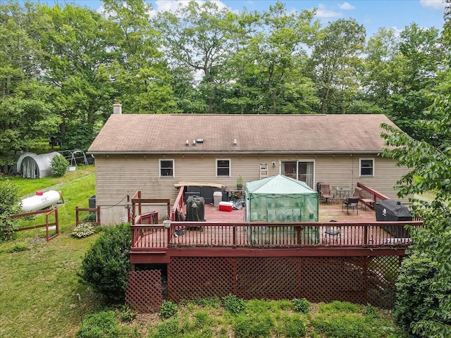 600 N Harrity Rd, Palmerton, PA 18071 - back of property featuring a wooden deck, a chimney, a lawn, and outdoor dining area