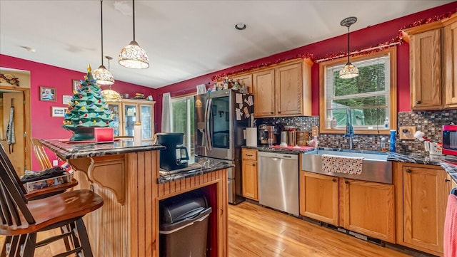 600 N Harrity Rd, Palmerton, PA 18071 - kitchen with stainless steel appliances, dark countertops, brown cabinetry, and tasteful backsplash