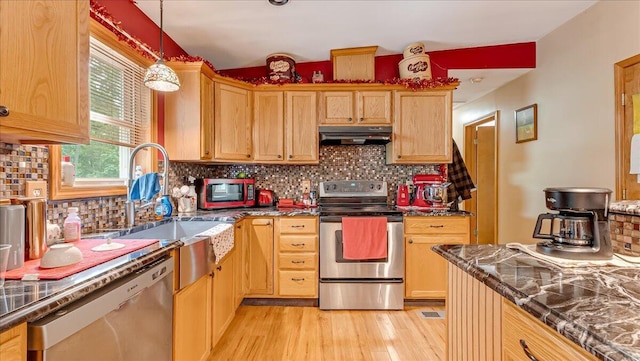 600 N Harrity Rd, Palmerton, PA 18071 - kitchen with appliances with stainless steel finishes, under cabinet range hood, decorative backsplash, and light wood-style floors