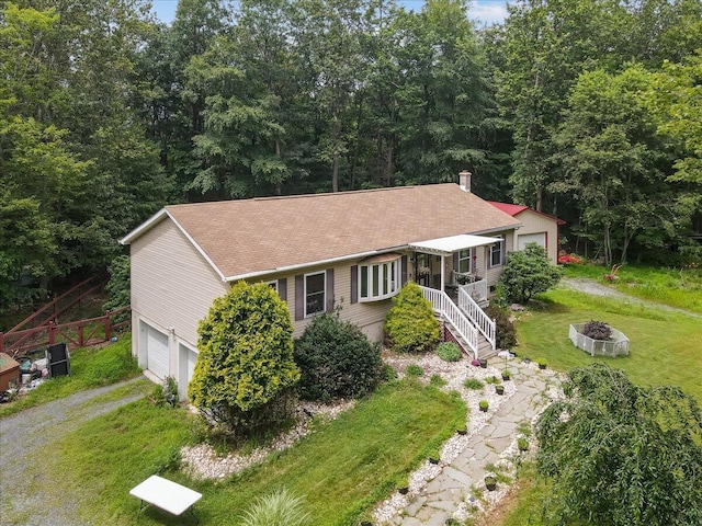 600 N Harrity Rd, Palmerton, PA 18071 - ranch-style house with an outdoor fire pit, roof with shingles, a garage, and driveway