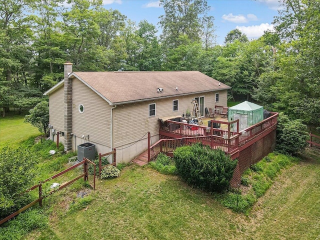 600 N Harrity Rd, Palmerton, PA 18071 - rear view of house with a wooden deck, a chimney, a lawn, and a shingled roof