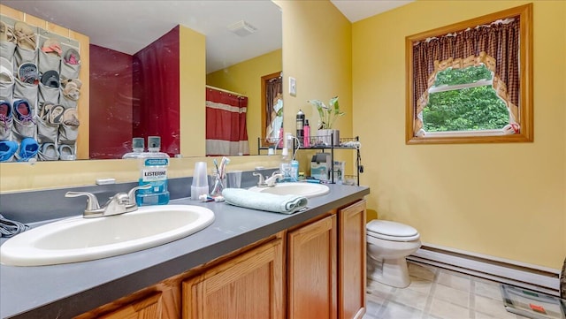 600 N Harrity Rd, Palmerton, PA 18071 - full bath featuring double vanity, a baseboard radiator, and curtained shower