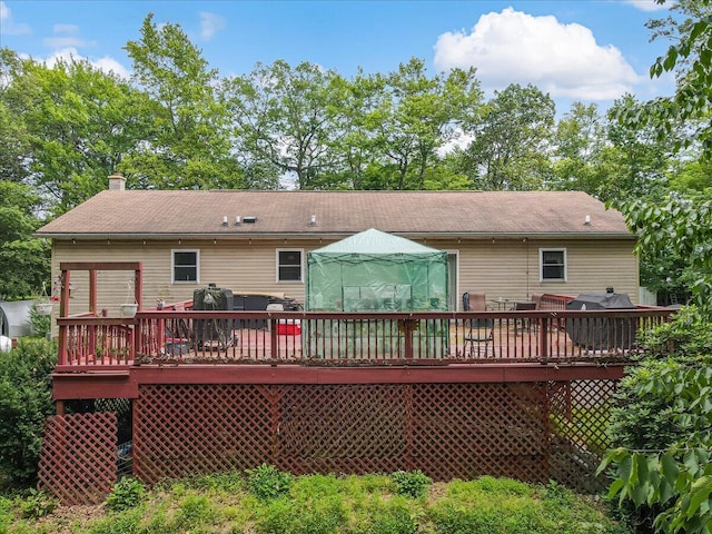 600 N Harrity Rd, Palmerton, PA 18071 - rear view of property featuring a deck, a chimney, and outdoor dining area