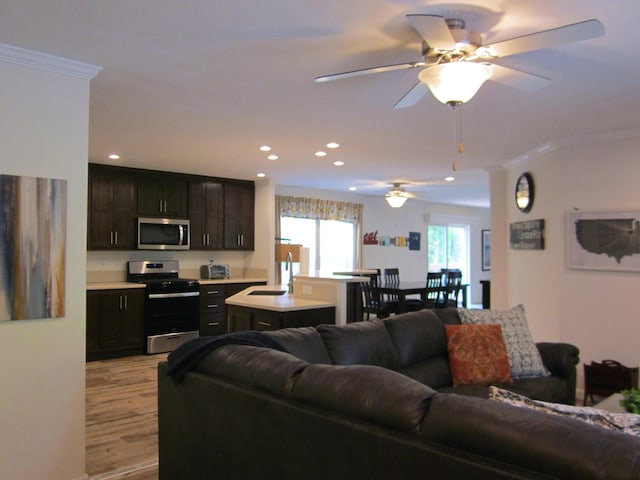 2016 Locust Ridge Rd, Pocono Lake, PA 18347 - living area with ornamental molding, light wood-style floors, recessed lighting, and ceiling fan