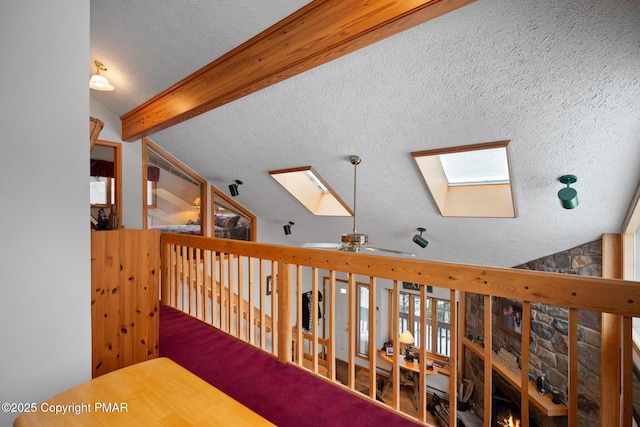 2222 Hillcrest Dr, Pocono Pines, PA 18350 - hall with lofted ceiling with skylight and a textured ceiling