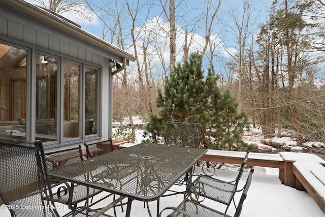 2222 Hillcrest Dr, Pocono Pines, PA 18350 - snow covered deck featuring outdoor dining area and a sunroom