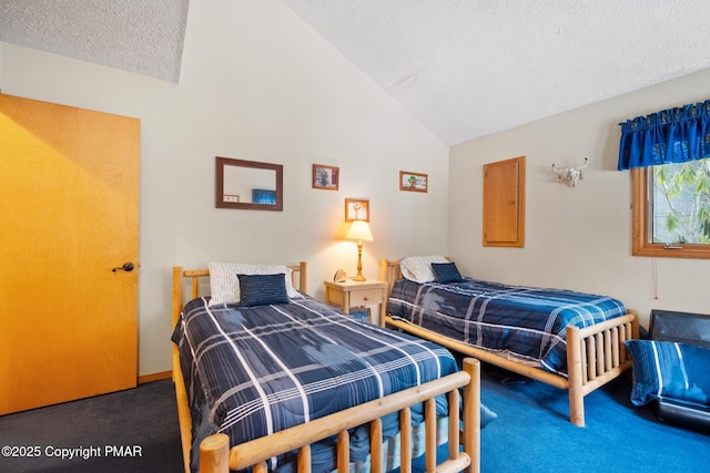2222 Hillcrest Dr, Pocono Pines, PA 18350 - bedroom with vaulted ceiling, a textured ceiling, and carpet floors