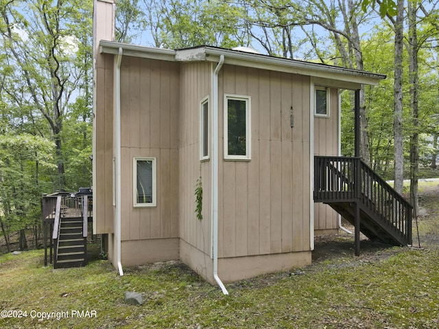 view of outbuilding with stairway