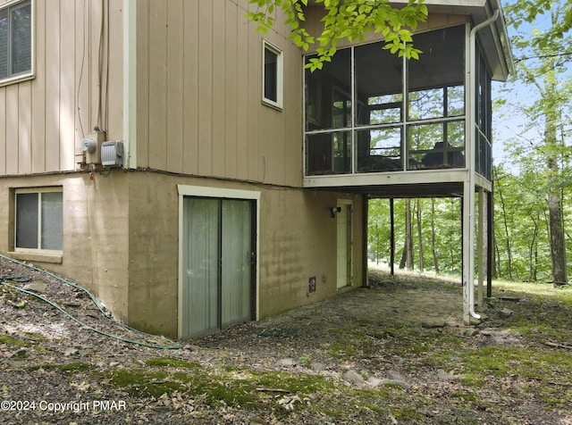 back of house with a sunroom