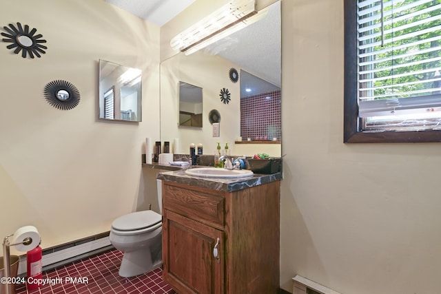 bathroom with tile patterned floors, toilet, a baseboard heating unit, baseboard heating, and vanity