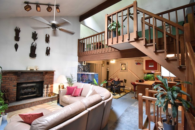 158 Saunders Dr, Bushkill, PA 18324 - living area with stairway, a brick fireplace, a ceiling fan, beam ceiling, and high vaulted ceiling
