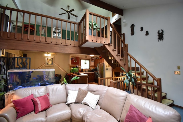 158 Saunders Dr, Bushkill, PA 18324 - living room featuring a ceiling fan, stairs, and a towering ceiling