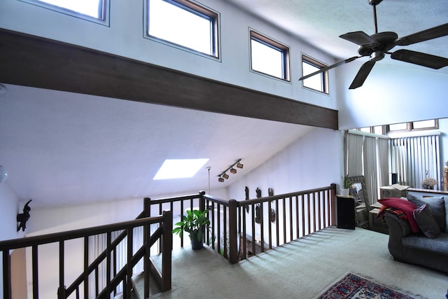 158 Saunders Dr, Bushkill, PA 18324 - hallway featuring carpet flooring, a towering ceiling, an upstairs landing, and a skylight