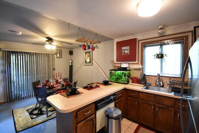 158 Saunders Dr, Bushkill, PA 18324 - kitchen with white dishwasher, light countertops, ceiling fan, a sink, and a peninsula