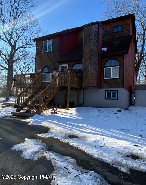 view of front of house with stairs