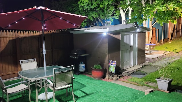 129 W Broadway, Jim Thorpe, PA 18229 - view of patio featuring a shed, outdoor dining area, an outdoor structure, and fence