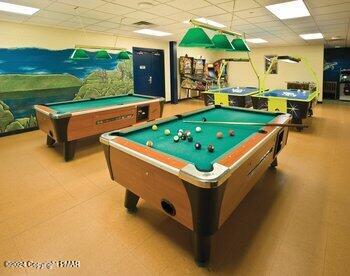 rec room with pool table and a paneled ceiling