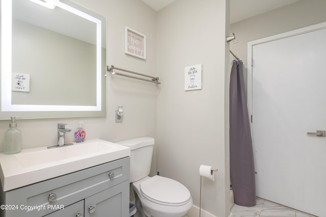 full bathroom featuring toilet, marble finish floor, a shower with shower curtain, and vanity