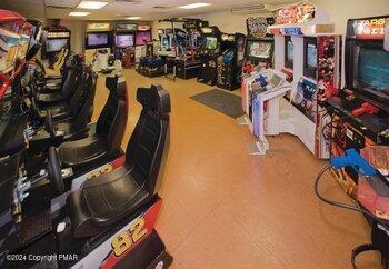 workout area with a paneled ceiling