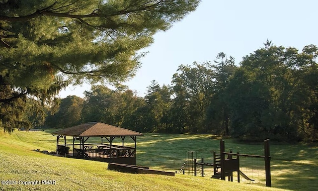 view of property's community featuring a yard and a gazebo