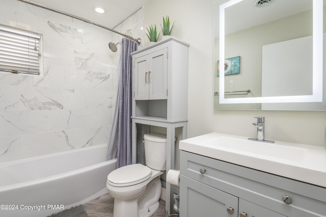 full bath with toilet, shower / bath combo, visible vents, and vanity