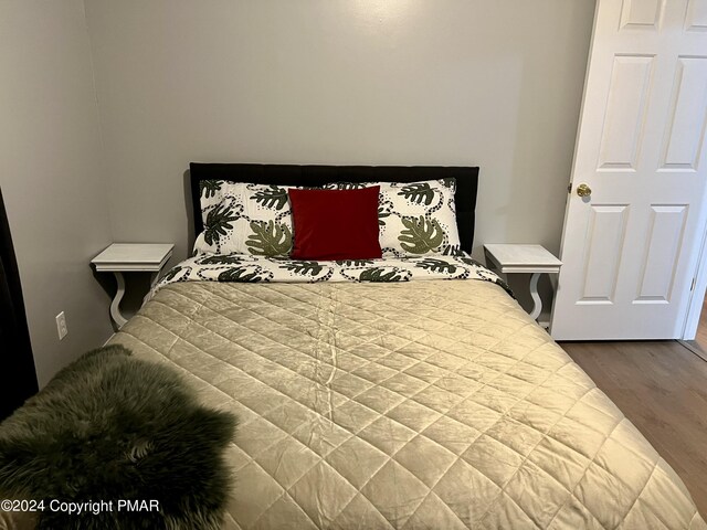 bedroom featuring wood finished floors