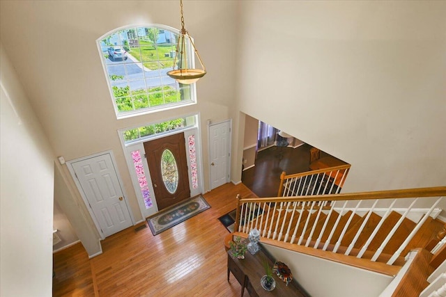 2358 Snapdragon Pt, East Stroudsburg, PA 18301 - foyer with a towering ceiling, stairs, and wood finished floors