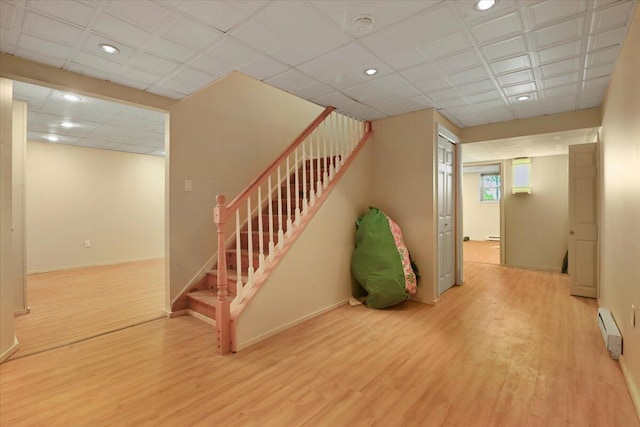 2358 Snapdragon Pt, East Stroudsburg, PA 18301 - stairway with a baseboard heating unit, wood finished floors, and recessed lighting