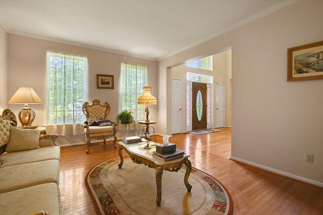 2358 Snapdragon Pt, East Stroudsburg, PA 18301 - living area with light wood finished floors, healthy amount of natural light, and crown molding